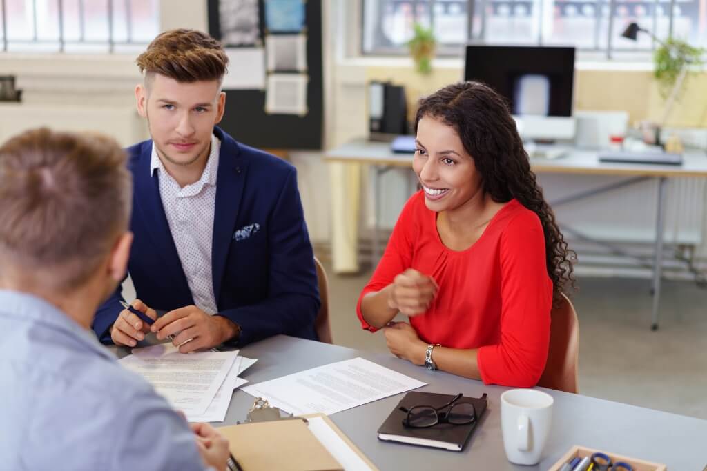 Lawyer Discussing With His Smiling Client